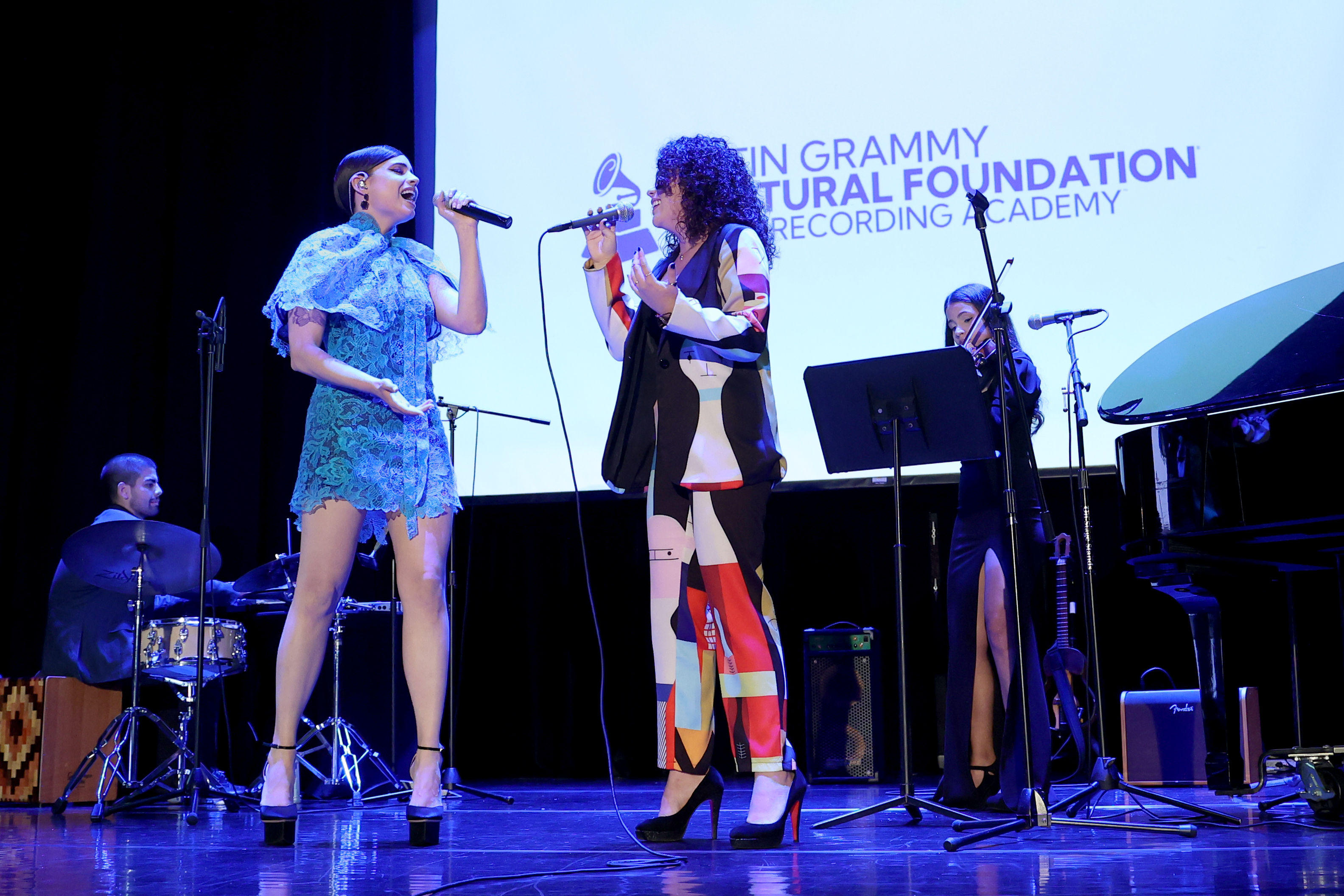 Valentina García performing with Sofia Carson